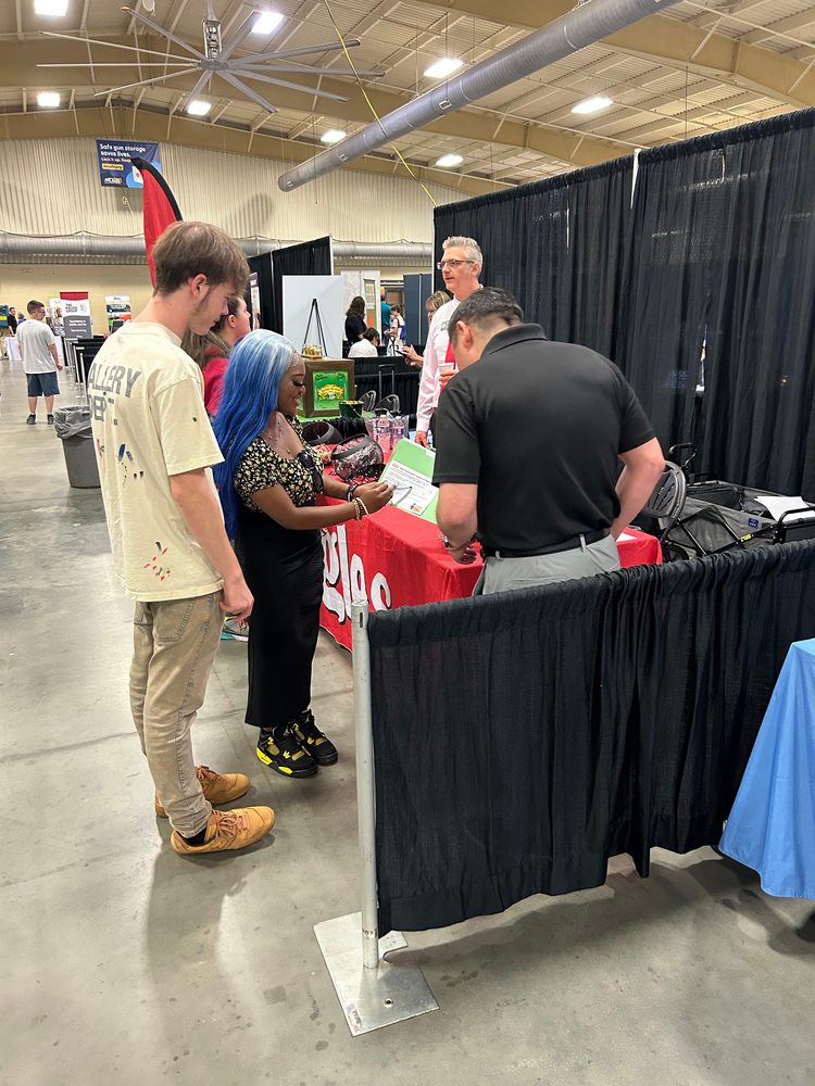 Students talking to employees from Ingles.
