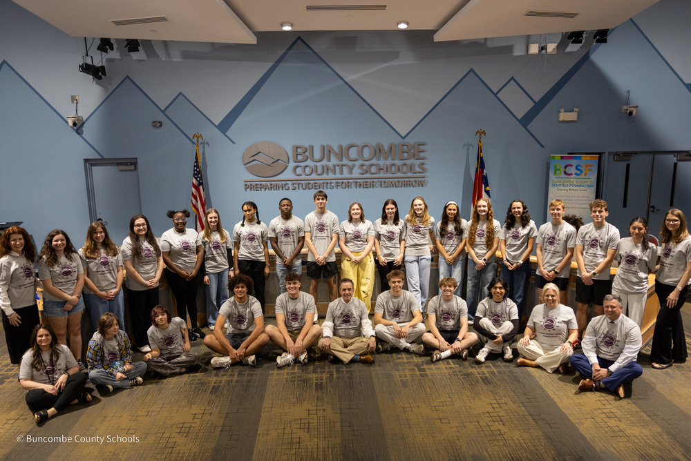 Members of the Student Advisory Council gather for a group photo in matching shirts in the BCS Minitorium.