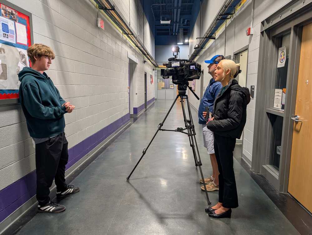 A Nesbitt student is interviewed in the hallway by News 13 reporter Chloe Adams.