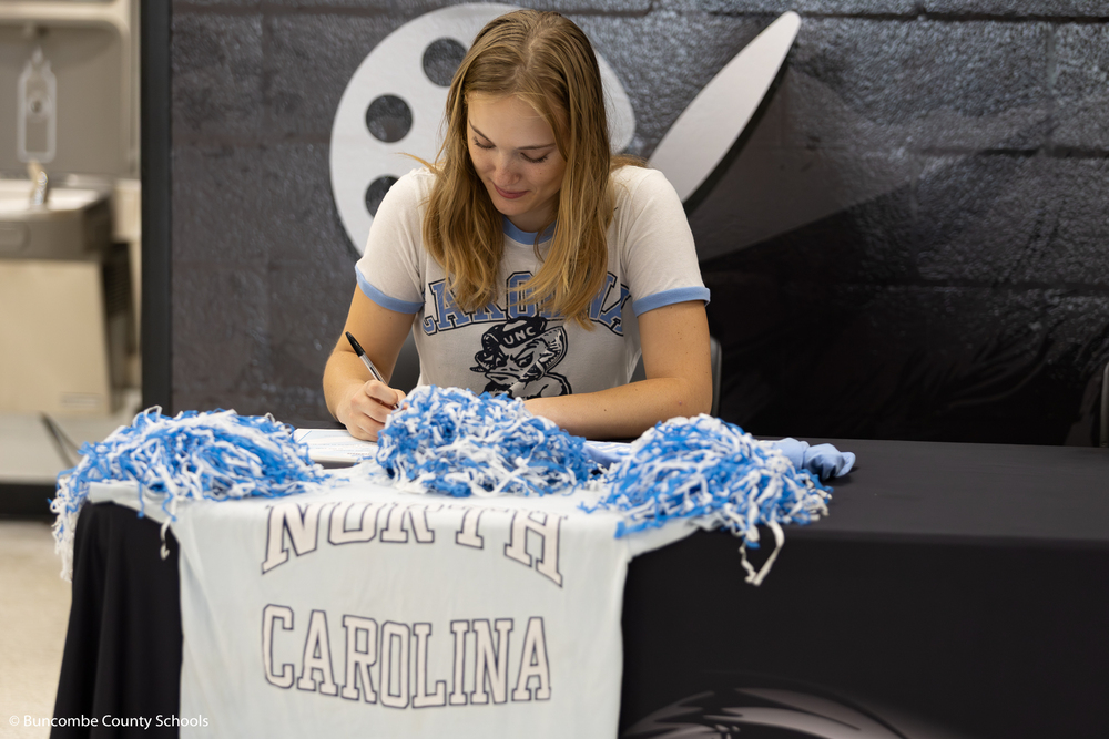 Student signing her letter of intent for the University of North Carolina at Chapel Hill.