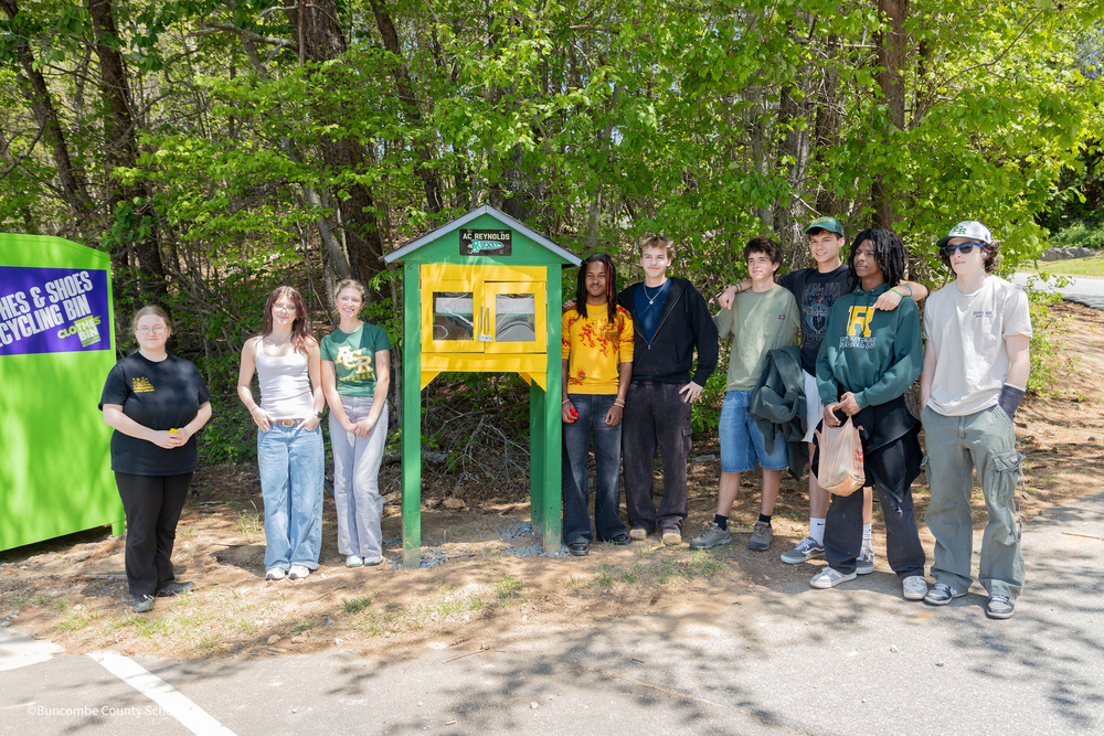 ACRHS Engineering Students stand next to food pantry