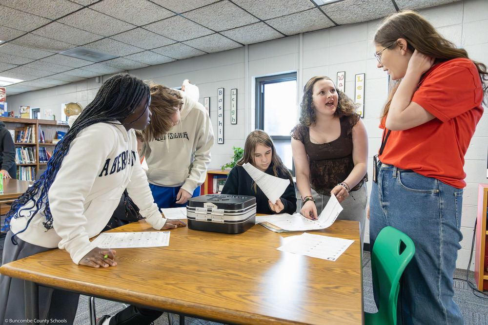 Students talk to Erwin Middle media coordinator Malorie Hudson.
