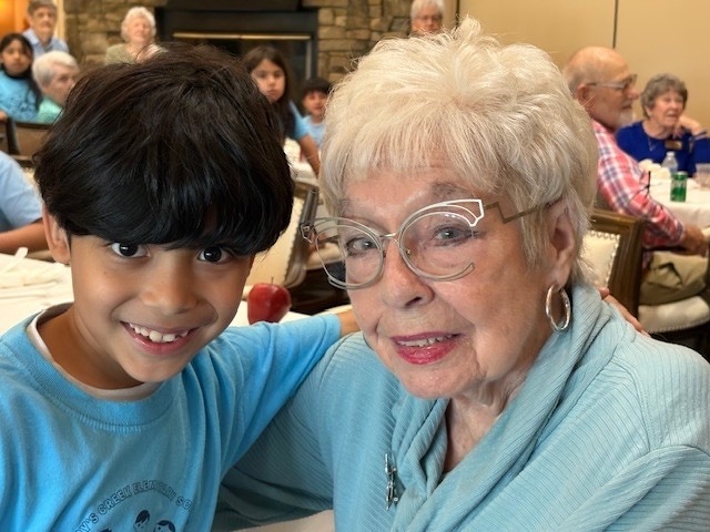 Student posing with a resident from Ardenwoods Retirement Home.