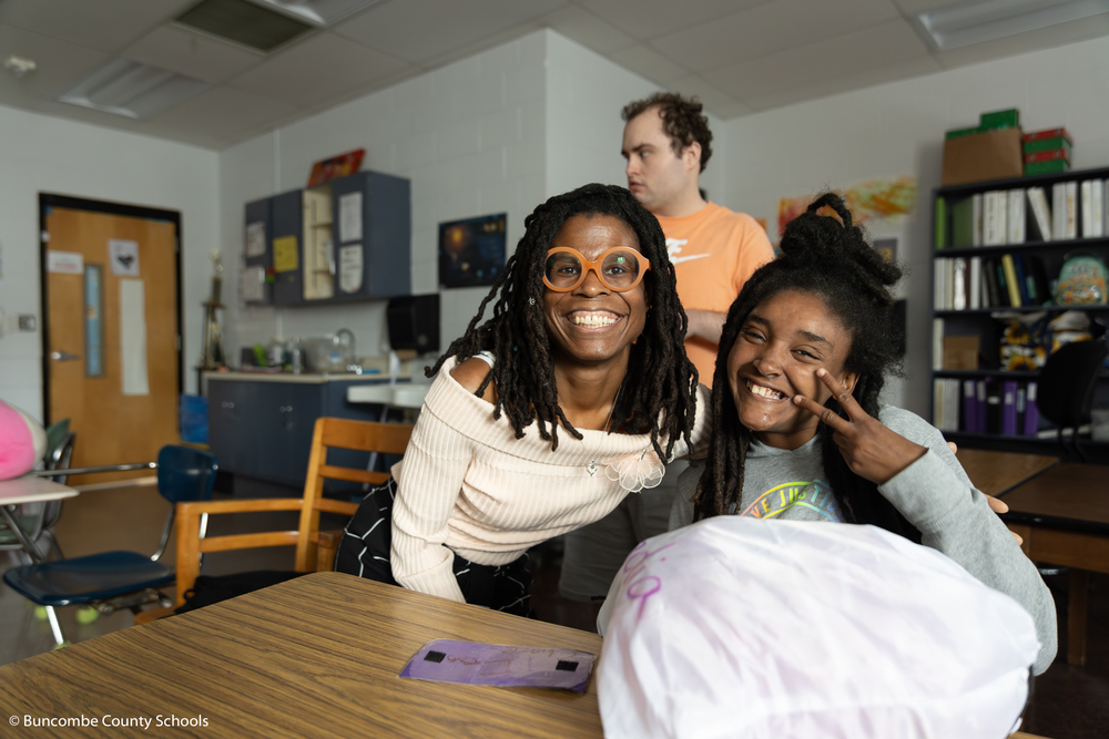 Dr. Thea Wilson posing with a student.