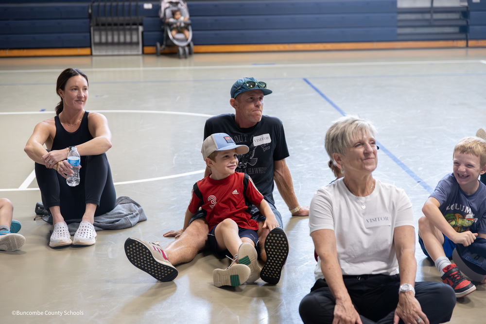 student sitting with parent