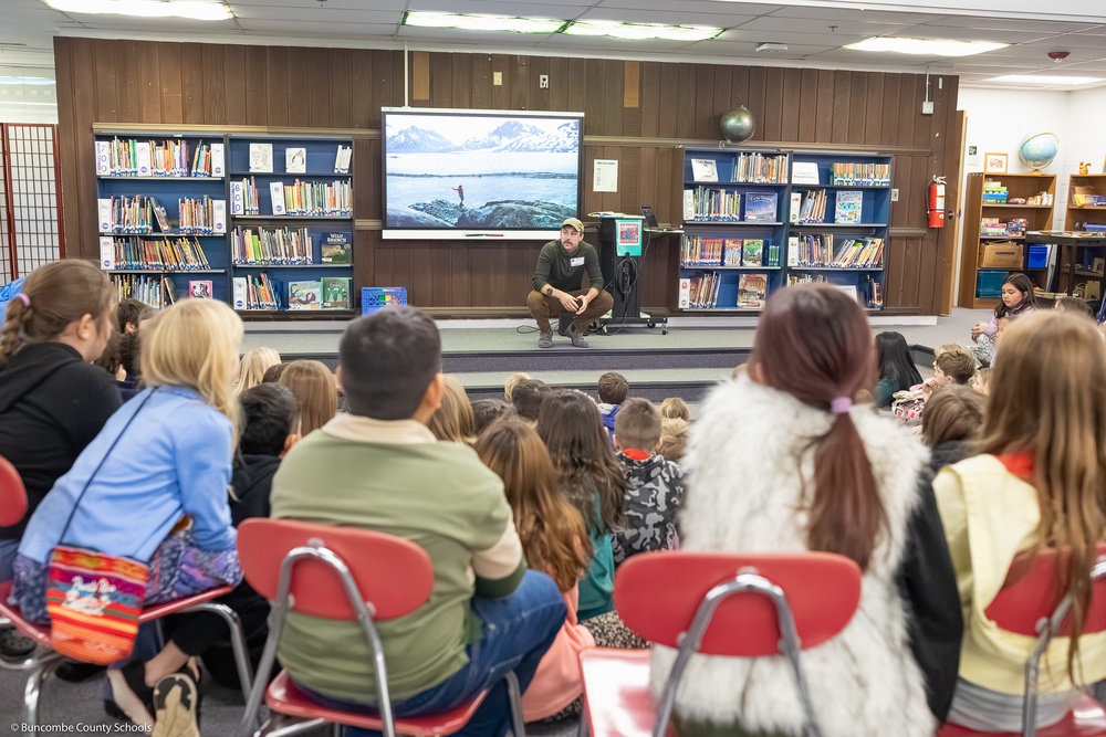 Jacob Myers speaks to students in the media center.
