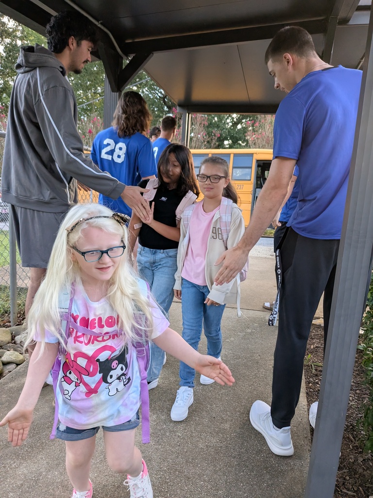 Students high five to class