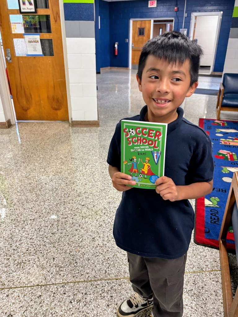 Fourth grader with new book