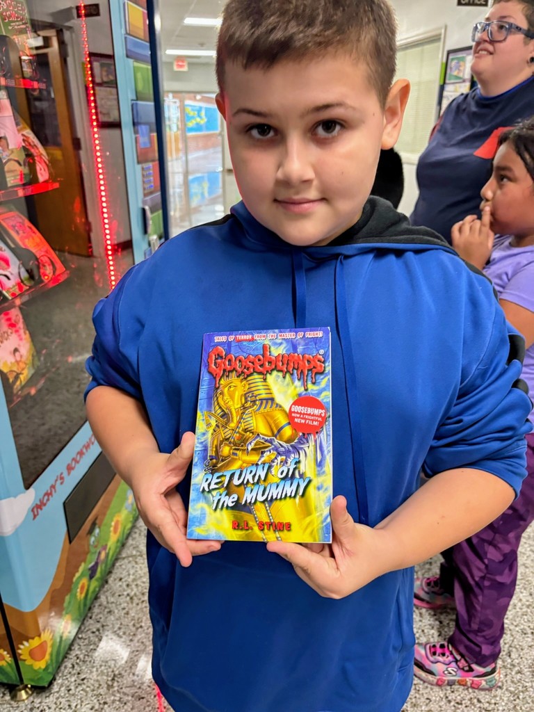 Fourth grader with new book