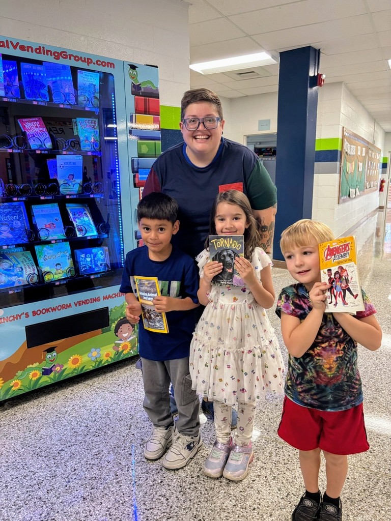 Ms. Ayers with kindergarten birthday book recipients 