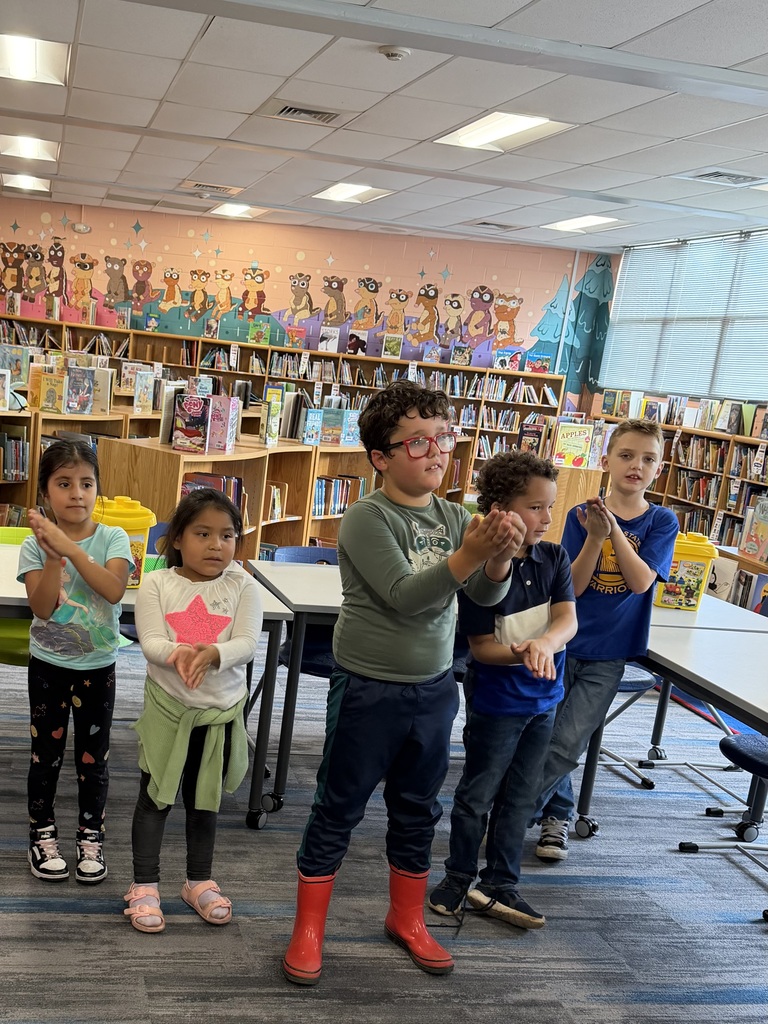 Students practicing their book parts motions