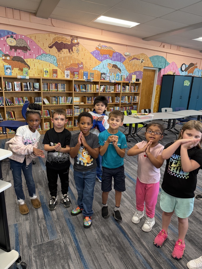 Students practicing their book parts motions