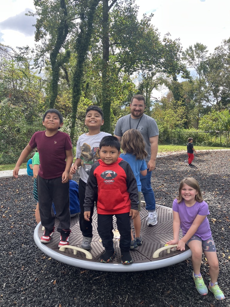 Students and Mr. H playing on playground