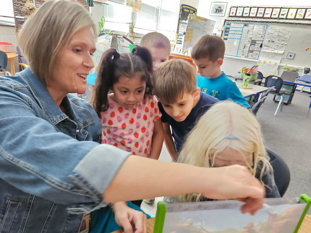 Students and teacher working together