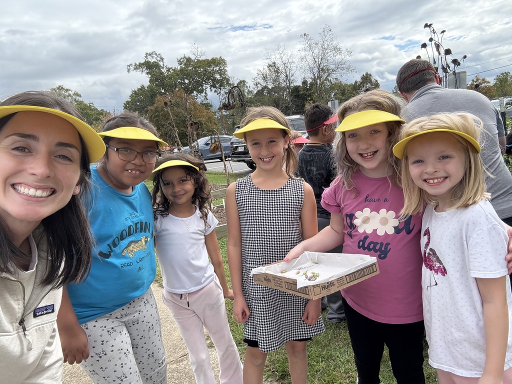 Students and staff preparing to plant their seeds