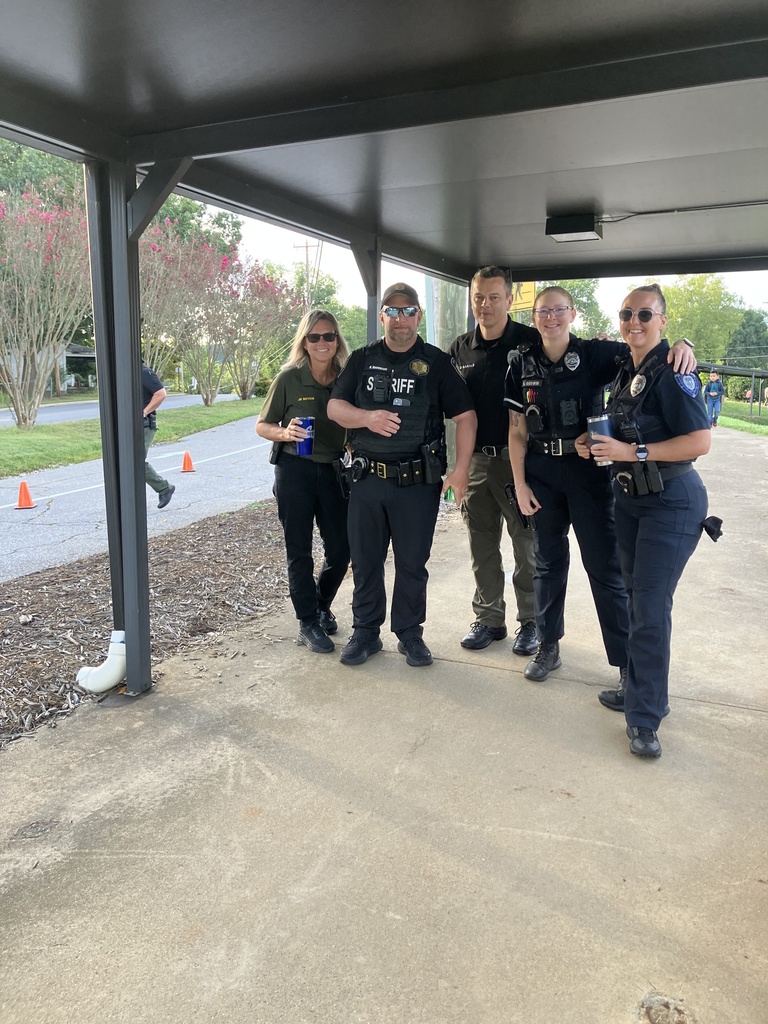 Officer Holden with Woodfin Police Officers in front of Woodfin Elementary