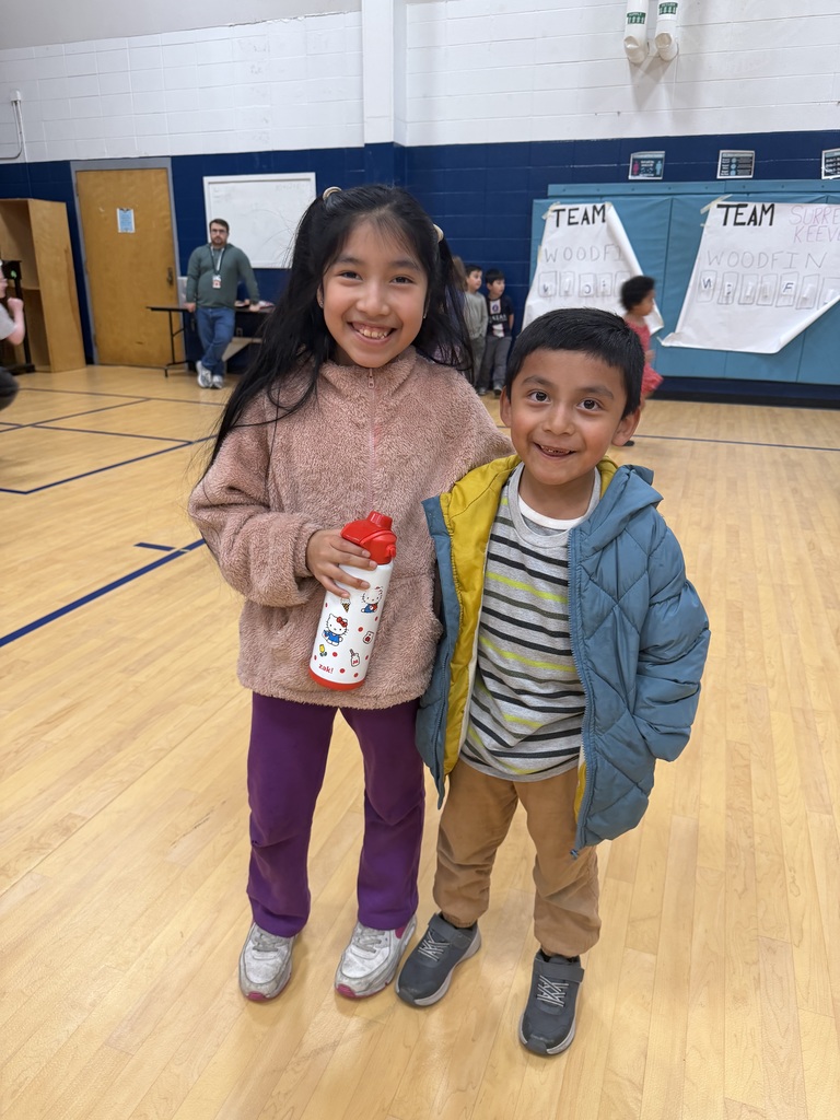 Two students smile for photo.