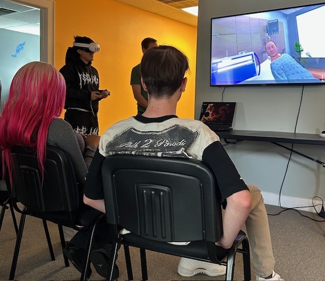student using a VR headset with a computer program