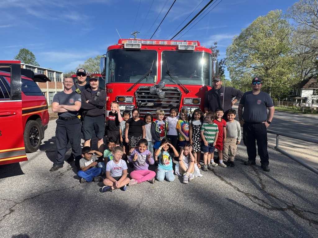 Woodfin Fire Department firemen stand with WES kindergarten class in front of a fire truck