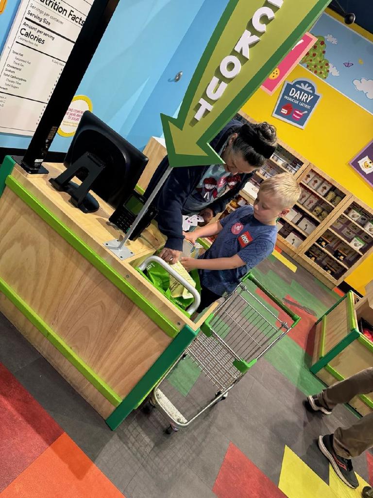 Mrs. Gloria supporting student 
