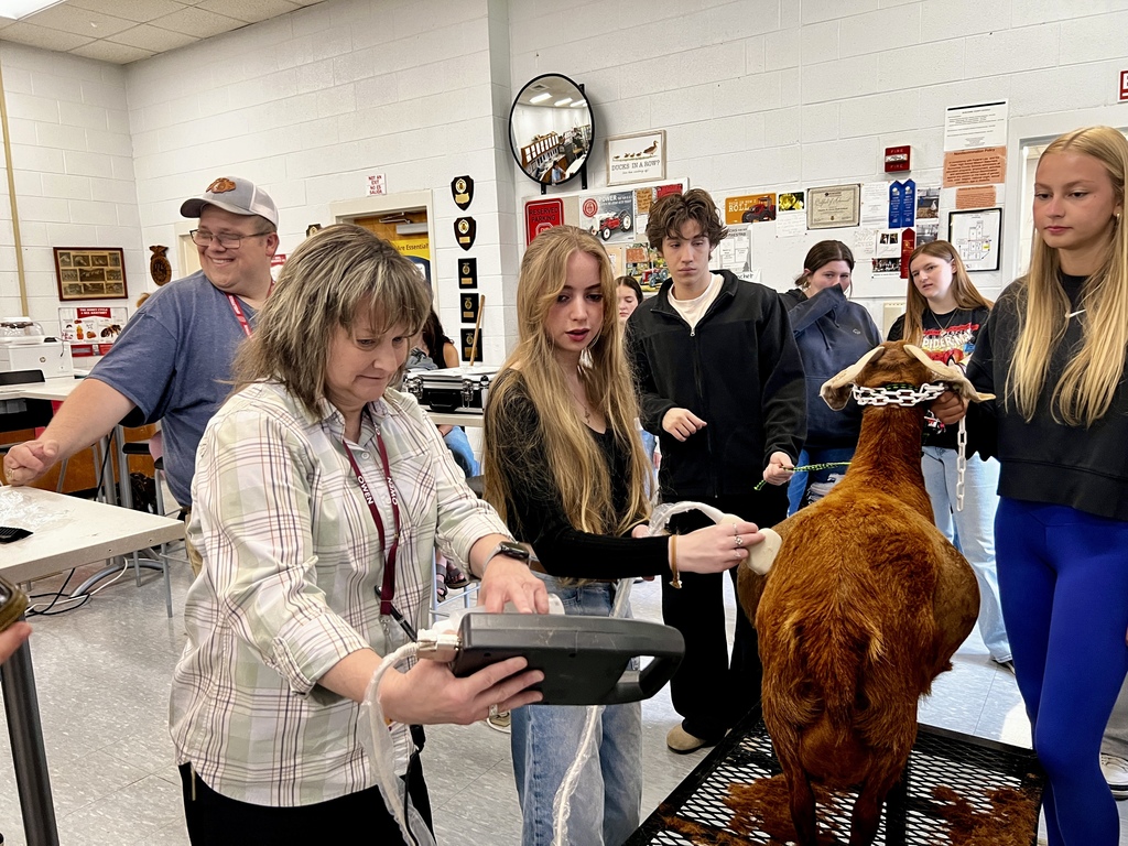 Health science students use new ultrasound equipment to scan pregnant goat in OHS animal science classroom