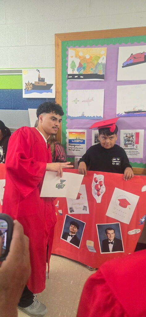 Erwin High graduates walk Woodfin Elementary School halls. 