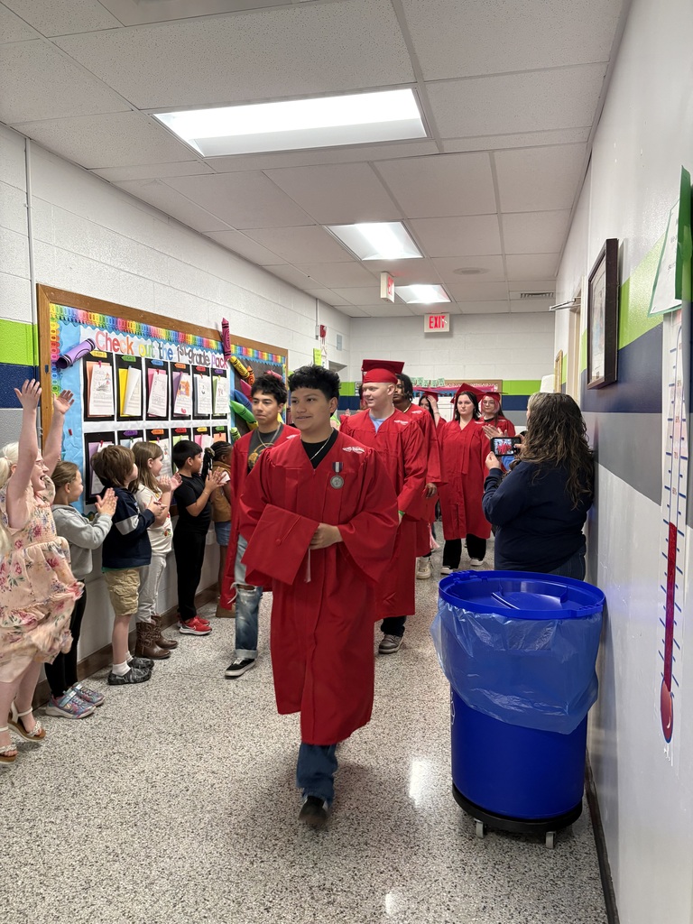 Erwin High graduates walk Woodfin Elementary School halls. 