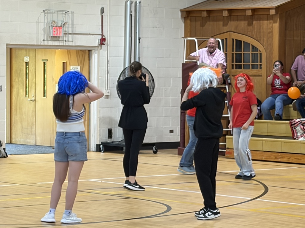 group of students wearing wigs for a game 