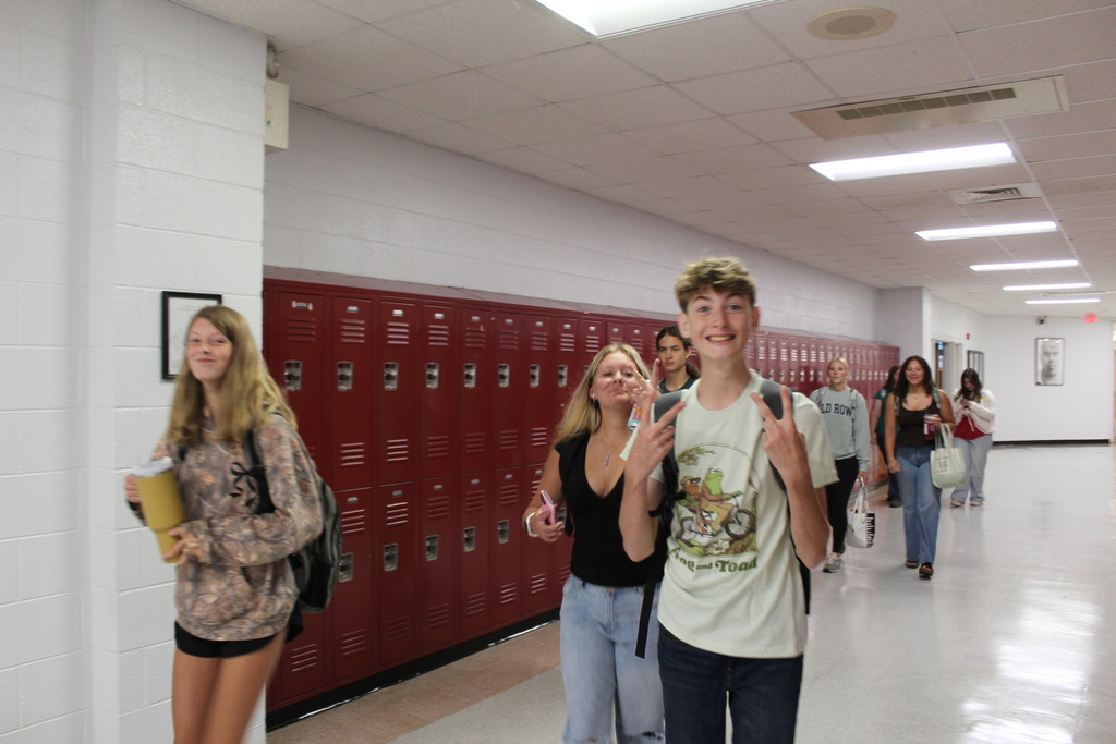 OHS students smiling in the hallway on the way to class
