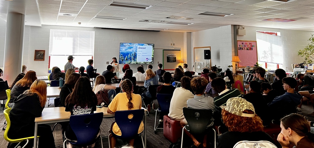 Students listen to Maggie's Peace Corpse presentation