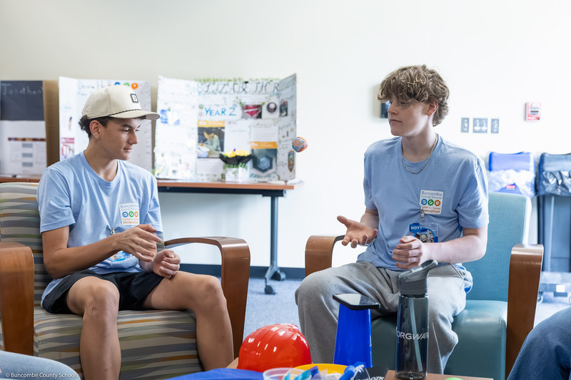 A student throws a ball to another student during an ice breaker game.