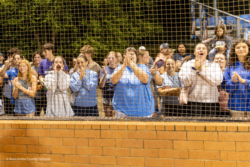 Fans in the stands clap