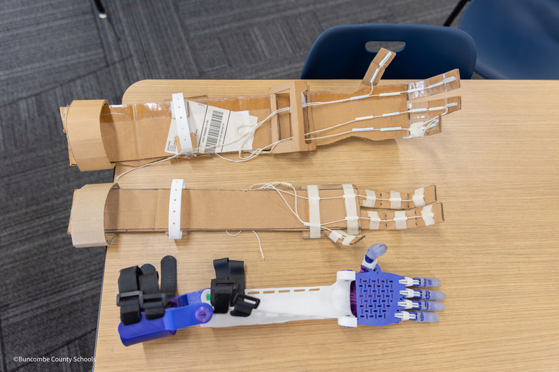 Versions of cardboard and 3D printed  arms
