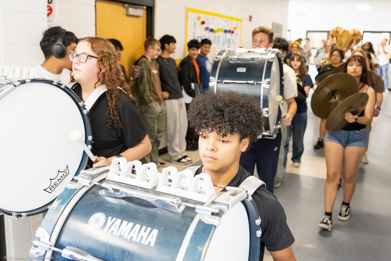The drumline plays during the parade.