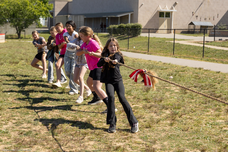 Students play tug-of-war.