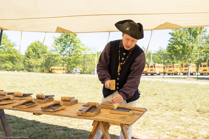 A Camp Flintlock staff member demonstrates journal making.
