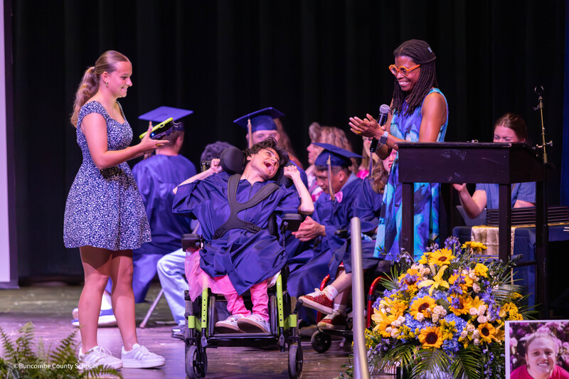excited student smiles as principal smiles