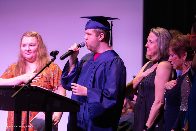 Student speaking into microphone