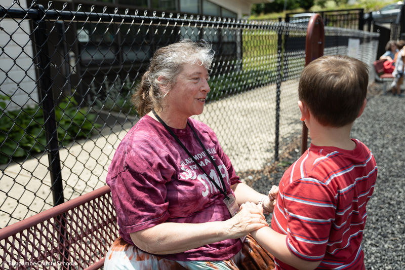 Ms. Beth Eckstein talking to a student. 