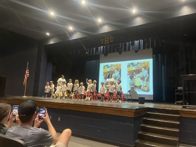 T.C. Pre-K graduates performing on stage. 