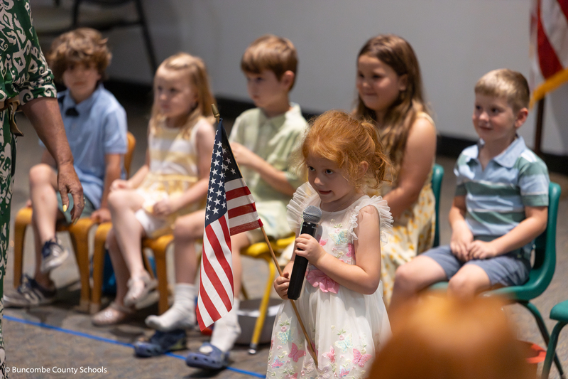 Pre-K student saying the pledge of allegiance. 