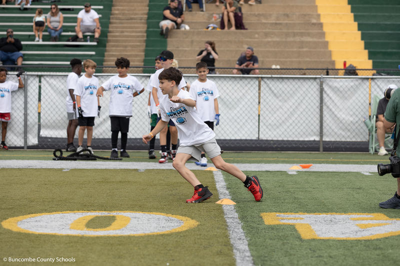 Kid running on the field. 