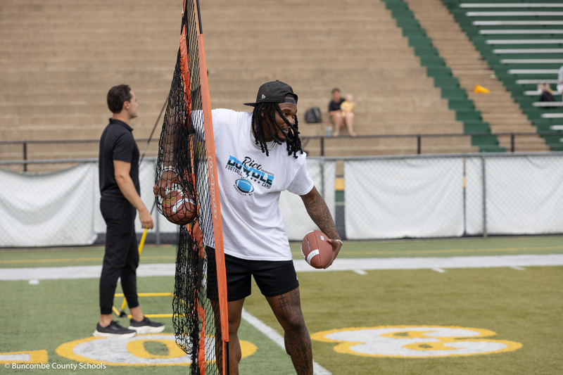 Rico getting a football out of a net. 