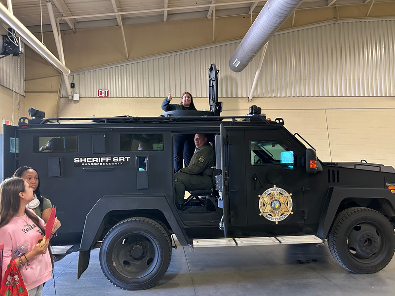 Students standing in the BCAT car from the Buncombe County Sheriff's Department. 