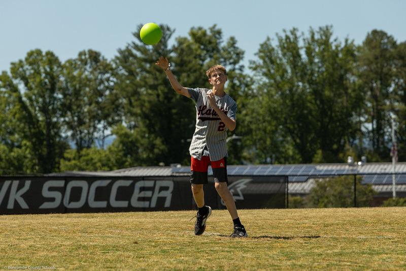A fielder throws a ball from first base.