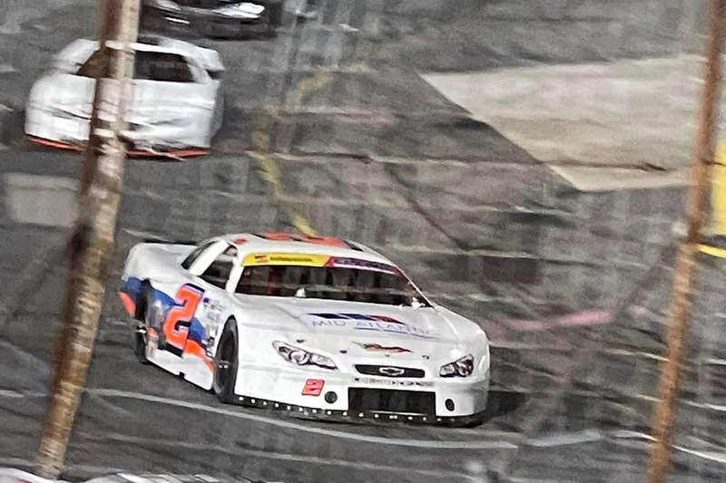 Canipe's No. 2 racecar speeds around a track.