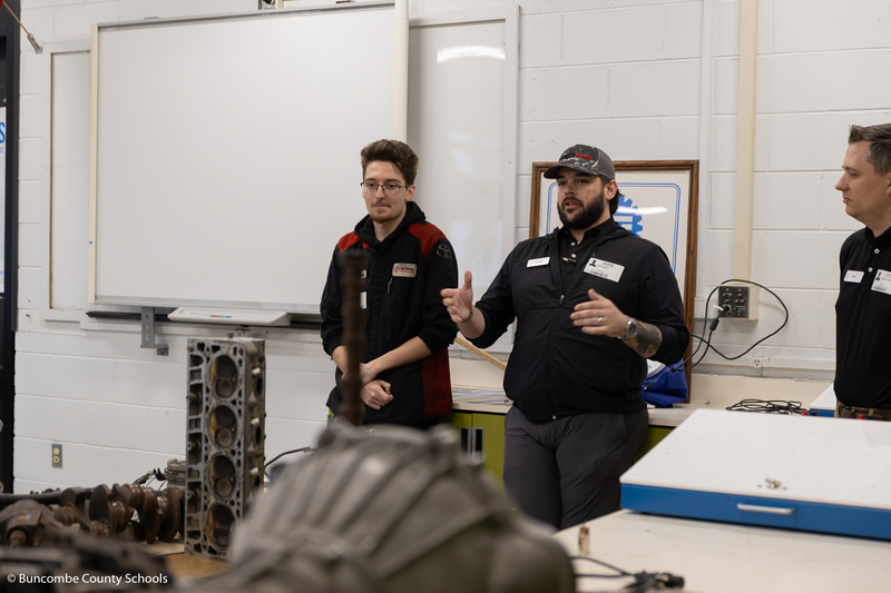 Guest speakers talking to students. 