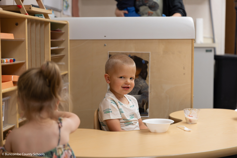 Toddler eating a snack. 