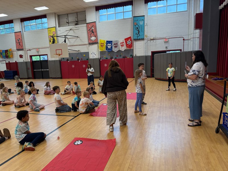 Students going head to head with a multiplication problem. 