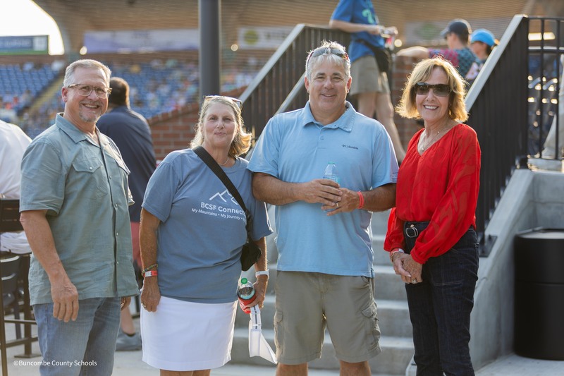 4 people pose for a picture
